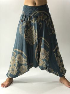 "These super soft rayon baggy unisex harem pants have the \"flow\", perfect of yoga or just a cool strolling. Comfort and character are what these pants are all about. They have the traditional sarong look & feel but a lot more practical when it comes to activity like yoga. As a bonus, they are convertible! Just pull them up and you get yourself a cute jumpsuit in a flash. Together with elastic cuff legs, you can wear them short or long. The pants have smock waist (wide bang elastic) with no Bohemian Relaxed Fit Harem Pants For Yoga, Bohemian Harem Yoga Pants With Relaxed Fit, Bohemian Relaxed Fit Harem Yoga Pants, Bohemian Drop Crotch Yoga Pants, Bohemian Yoga Pants With Drop Crotch, Relaxed Fit Harem Pants For Yoga, Hippie Baggy Bottoms For Yoga, Hippie Harem Yoga Pants For Meditation, Baggy Harem Pants For Meditation