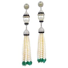 This gorgeous round white freshwater pearl tassel earring with diamonds and emeralds in 18K white gold is simply stunning. This earring is 3 inch long Closure: Push Post 18K:14.51gms Diamond: 10.11cts Emerald:19.15ct Onyx:5.60cts Pearl:105.2cts Kate Middleton Jewelry, Lovers Knot Tiara, Iconic Jewelry, Pave Bracelet, Tassel Earring, Tanzanite Earrings, Diamond Tiara, White Freshwater Pearl, Pearl Gemstone