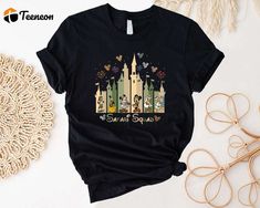 a black shirt with disney castle and fireworks on it