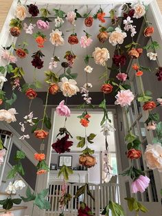 flowers hanging from the ceiling in a house