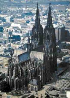 an aerial view of a large cathedral in the city