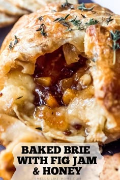 baked brie with fig jam and honey is shown in the middle of this image