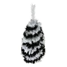 a black and white christmas tree with feathers on it's top, against a white background