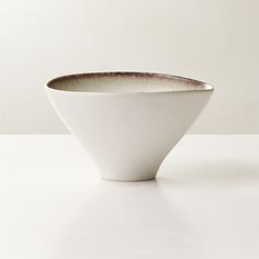 a white bowl sitting on top of a table