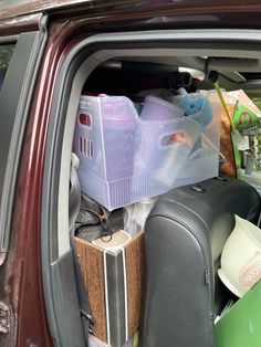 the back door of a car filled with items