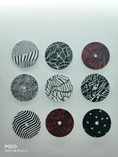 six different designs are shown on the back of these button covers, all in black and white