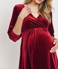 We can't get enough of this soft and beautifully flowing stretch velvet number for the holiday season into Vday! Looks flattering on all body types. Features a bonus opening for postpartum nursing-access. Color: Burgundy Above-the-knee Stretch Fabric: 92% Polyester 8% Spandex Maternity, Non-Maternity & Nursing-Friendly Size Chart Questions? Use the chat icon to connect with a stylist! Red V-neck Maternity Dress, Elegant Maternity Dresses For Winter, Elegant Maternity Winter Dresses, Elegant Red Long Sleeve Maternity Dress, Elegant Stretch Maternity Dress With V-neck, Elegant Fall Party Maternity Dress, Maternity Dresses Winter, Velvet Maternity Dress, Postpartum Dresses