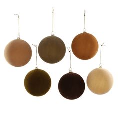 six different colored ornaments hanging from hooks