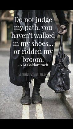 a man walking down the street with a handbag in his pocket and a quote on it