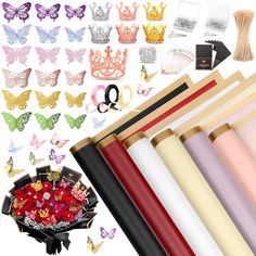 various colors and sizes of paper with scissors, hair clips, and other items in the background