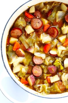 a pot filled with stew and vegetables on top of a table