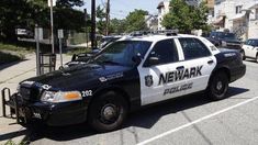 a police car is parked on the side of the road