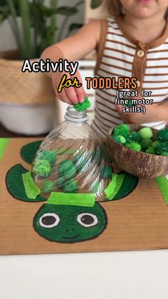 Turtle fun with the little one! 🐢Save this idea so you remember to try it too! Birdie is almost 17 months old. I repurposed the top of a water container and used it as a shell for a cardboard turtle. 💚 And my daughter had a blast using green pom poms to fill up the shell! So great for fine motor skills, hand-eye coordination, and speech development! 🙌 Plus, it's a fun sensory activity for little ones. Just a reminder, pom poms can be a choking hazard, so if you can’t supervise don’t do it! -A Fine Motor Activities One Year Old, Fun Activities For 16 Month Old, Crafts To Do With 15 Month Old, Easy Baby Activities 6-12 Months, Activities For 1 And A Half Year Olds, Daycare Rooms Setup Toddlers, Infant Sensory Activities Daycare, One Year Old Activities Daycare, Nursery Activities For Under 2s