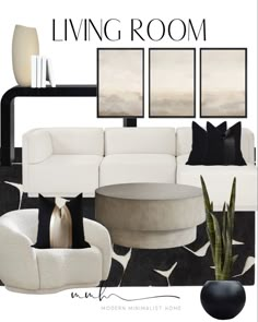 a living room with white furniture and black accents