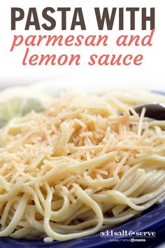 pasta with parmesan and lemon sauce on a blue plate next to a fork