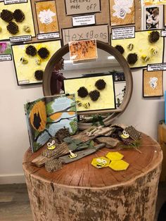 a wooden table topped with lots of different types of art and craft supplies on top of it