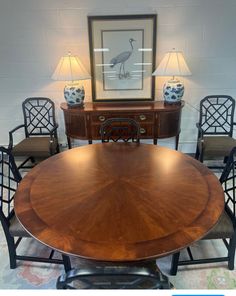 a dining room table with four chairs around it