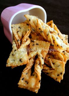 some crackers are sitting in a cup on a table