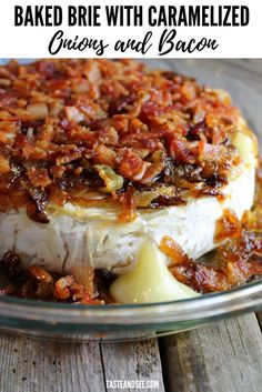 baked brie with caramelized onions and bacon in a glass dish on a wooden table