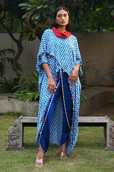 Blue zigzag shibori overlap top with bandhani print and handmade tassels, conch shell detailing on the hem. - Aza Fashions Blue Bohemian Bandhani Print Sets, Bohemian Blue Bandhani Print Sets, Blue Bohemian Kurta With Traditional Drape, Traditional Blue Kaftan With Batik Print, Overlap Top, Kaftan Top, Shibori Pattern, Fashion App, Online Tops