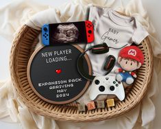 a basket filled with toys and t - shirts on top of a table