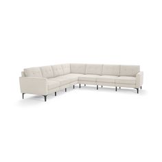 a white sectional couch with wooden legs on an isolated background, facing the right side