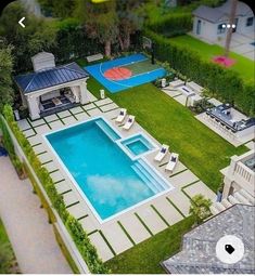 an aerial view of a backyard with a swimming pool