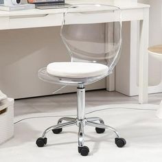 a clear office chair sits in front of a white desk