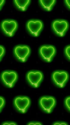 green neon hearts on a black background