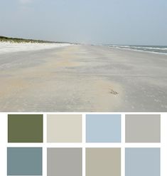 the beach is covered in white sand and blue water, as well as several shades of gray