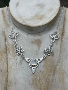 "I've fabricated a Celtic Irish inspired necklace with a center Celtic knot which features a center 8mm round cabochon, of your choosing in the drop down menu, with a total of three component pieces on either side. The sterling chain of 16 inches is soldered to each end making the approximate length of this piece just a bit over 18\" total. The chain will have a sturdy lobster claw. I've fabricated everything in sterling silver - it's a heirloom piece! This is a beautiful and feminine statement Silver Necklace With Cabochon Round Stone, Adjustable Cabochon Round Pendant Necklace, Moonstone Cabochon Round Pendant Necklace, Irish Necklace, Irish Wedding, Inspired Necklace, Irish Celtic, Gifts For My Wife, Moonstone Necklace