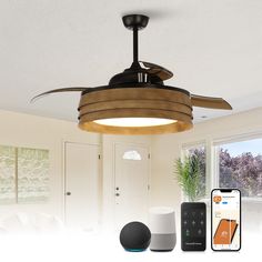 a ceiling fan with remote controls and an appliance in front of the door