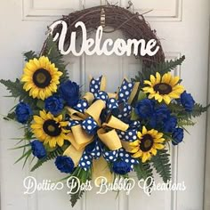 a welcome wreath with sunflowers and blue flowers