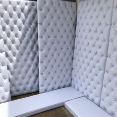 three different types of mattresses lined up against each other in a room with concrete flooring