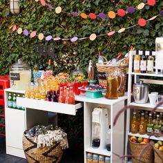 an outdoor bar set up with drinks and condiments for a party or brunch