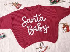 Custom Name Sweater,baby shower gift,Baby Name,Customised Baby Gifts,Newborn Gift,Baby Name Sweater,personalised gifts,christmas-gifts,Christmas baby,baby christmas sweater,my first christmas,christmas romper,santa baby embroider This sweater is comfortable, soft and makes a statement. Each sweater is carefully crafted by our experienced craftsmen using high-quality natural yarns to ensure your baby stays warm and comfortable during the colder seasons. There is an option to add your baby's name Newborn First Christmas, Baby Christmas Sweater, Christmas Romper, Cadeau Baby Shower, Pull Bebe, Custom Baby Gifts, Embroidered Christmas, Unique Sweaters, Baby Sweater