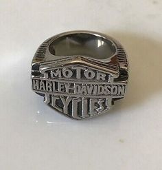 a silver ring with the words harley davidson on it