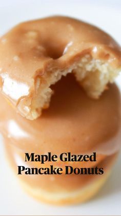 a close up of a doughnut with a bite taken out of it and the text baked pancake mix with maple glaze