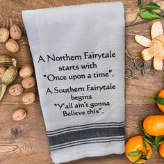 an embroidered tea towel with the poem, a northern fairytale starts with'once upon a time '