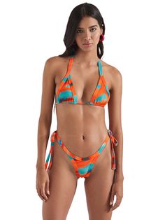 Eye-catching triangle top, featuring a vibrant placement print that adds a unique and artistic touch to your swimwear collection. This top includes removable pads for adjustable comfort and support, and it ties at the back and neck for a customizable, secure fit. Perfect for beach days or lounging by the pool, this top combines functionality with standout style. Check out versatile bottom, designed with a stylish placement print that makes a bold statement. Available in both skimpy cheeky and fu Adjustable Multicolor T-back Swimwear, Adjustable Triangle Halter Top For Vacation, Vibrant Triangle Top Swimwear For Poolside, Summer Triangle Swimwear With Tie Back, Triangle Halter Top With Adjustable Straps For Beach, Summer Triangle Tie Back Swimwear, Multicolor T-back Swimwear With Adjustable Straps, Summer Triangle Tie-back Swimwear, Triangle Halter Top For Beach