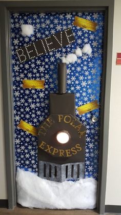 the door to an elevator is decorated with snow and gold ribbones that say believe it's not for express