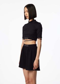 93.8% nylon 6.2% spandex.    model is 5ft 7" wears size s.    title tag  the blender: black mock neck top | 157moments High Stretch Black High Neck Crop Top, Black Stretch High Neck Crop Top, Black Tops With Medium Support In Elastane, Black Elastane Tops With Medium Support, Black High Neck Top For Streetwear, Black Elastane Crop Top With Short Sleeves, Black Short Sleeve Elastane Crop Top, Black Fitted Elastane Crop Top, Casual Stretchy Mock Neck Top