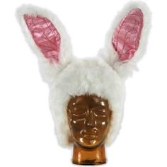 a white and pink bunny ear hat on a mannequin head