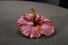 I am offering this fabulous vintage yellow gold tone pin. This piece is truly gorgeous, and it has the following features: * beautiful vintage brooch * enameled * floral design * pink * 2 inches in length This is a fantastic and classic piece. There is tons of sparkle and shine with this piece. It will beautifully complement your upcoming fashion season. Buyer pays all shipping and handling. Pink Enamel Pin Brooch For Wedding, Unique Pink Brooches As A Gift, Gold Flower Enamel Pin For Gift, Elegant Pink Enamel Pin For Gift, Unique Pink Brooches For Gifts, Gold Flower Enamel Pin Gift, Unique Pink Brooches As Gift, Elegant Pink Brooches For Collectors, Vintage Pink Brooches For Evening