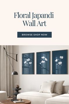 A minimalist set of 3 Japandi wall art pieces in white and deep indigo blue, showcasing Japanese cherry blossoms on a sleek blue background. This elegant floral design embodies the Japandi style and is available in all standard print sizes, making it effortless to enhance your home decor. Bring a sense of tranquility and timeless sophistication to any room with this stunning artwork.