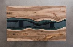 a piece of wood that has been made to look like waves in the water on it