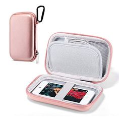 an open pink case sitting on top of a white table