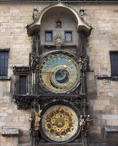 an ornate clock on the side of a building