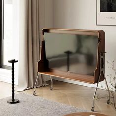 an entertainment center in the corner of a living room with a tv on it's stand