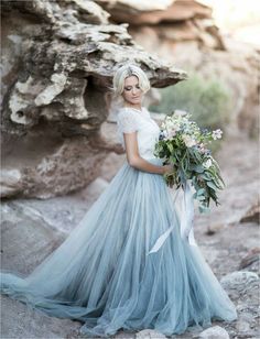 two pictures of a woman in a blue dress with flowers on her head and the same photo